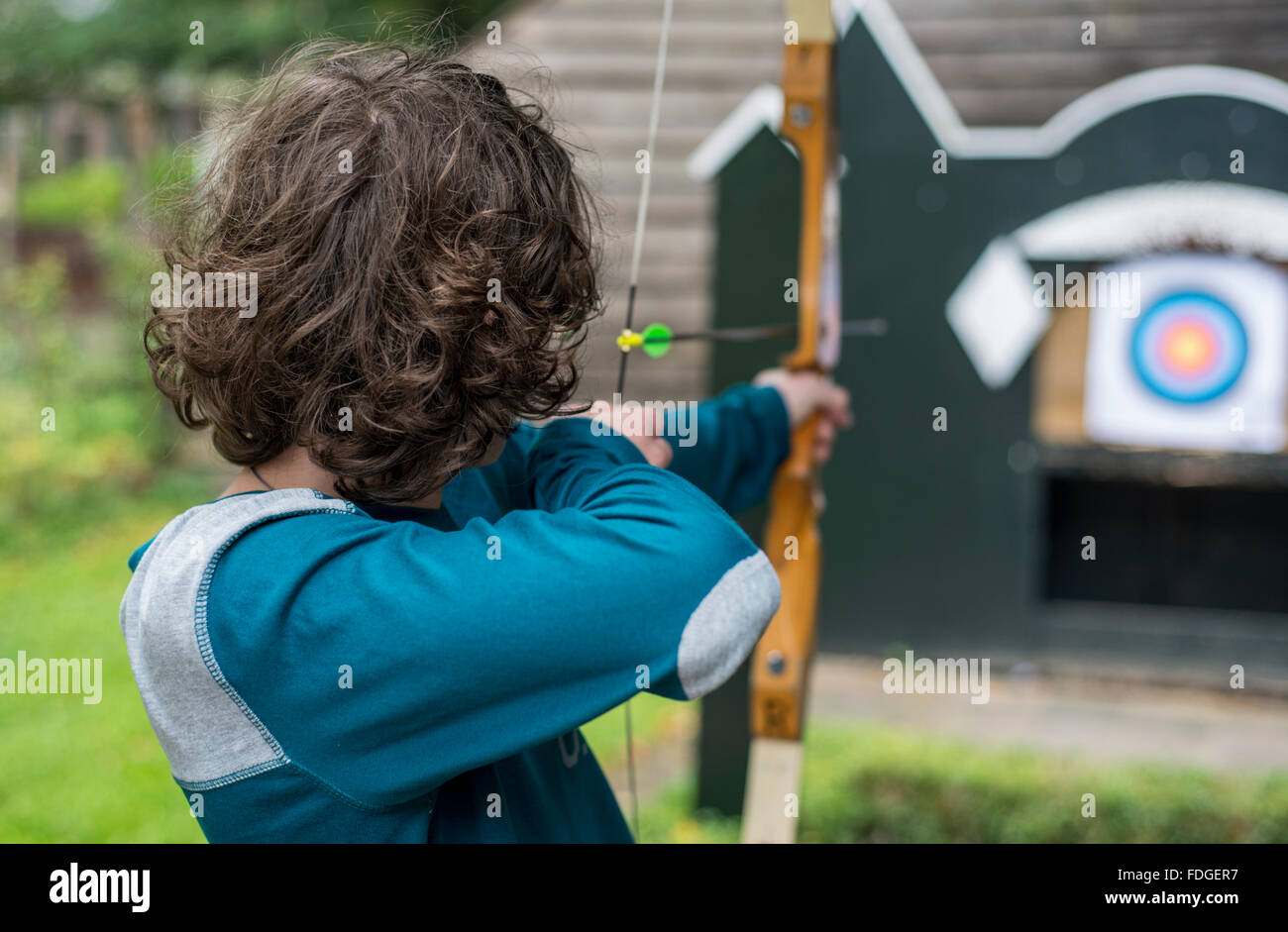 Teenage boy doing archery Stock Photo