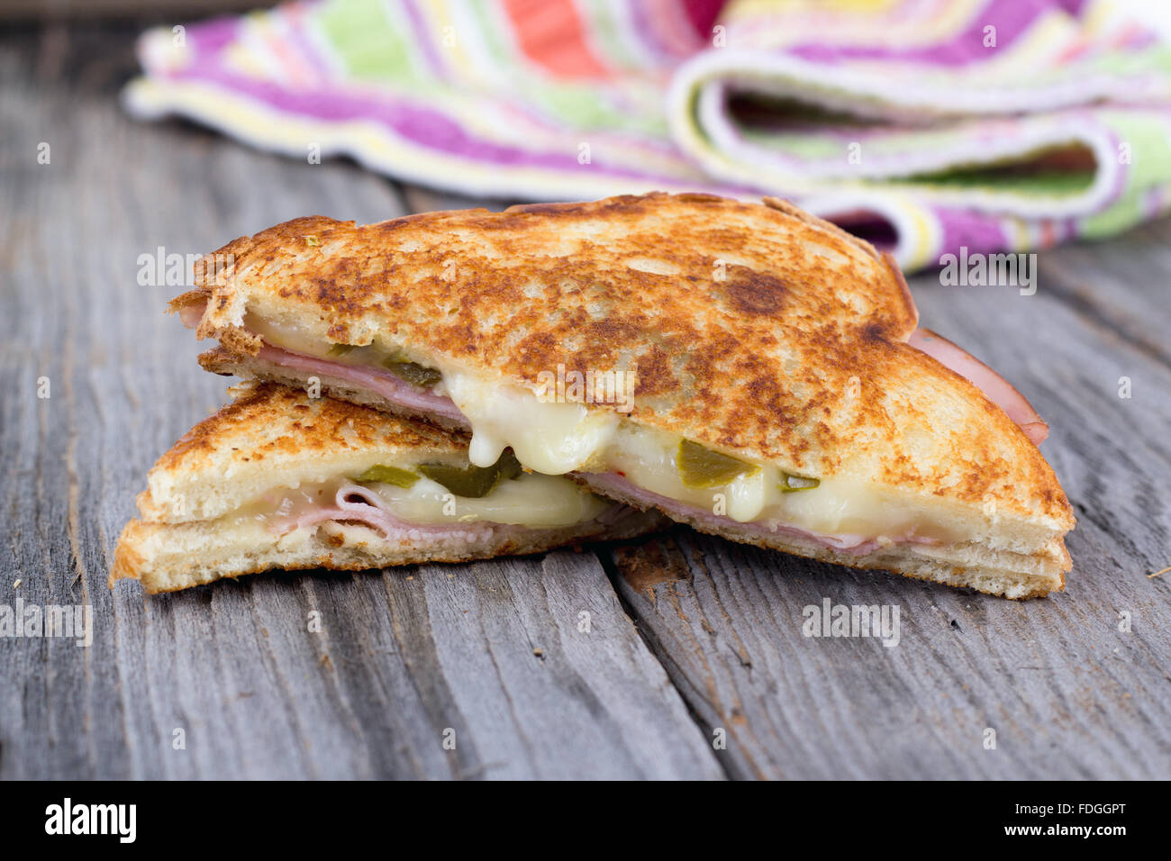 ham and cheese sandwich on rustic wooden table Stock Photo