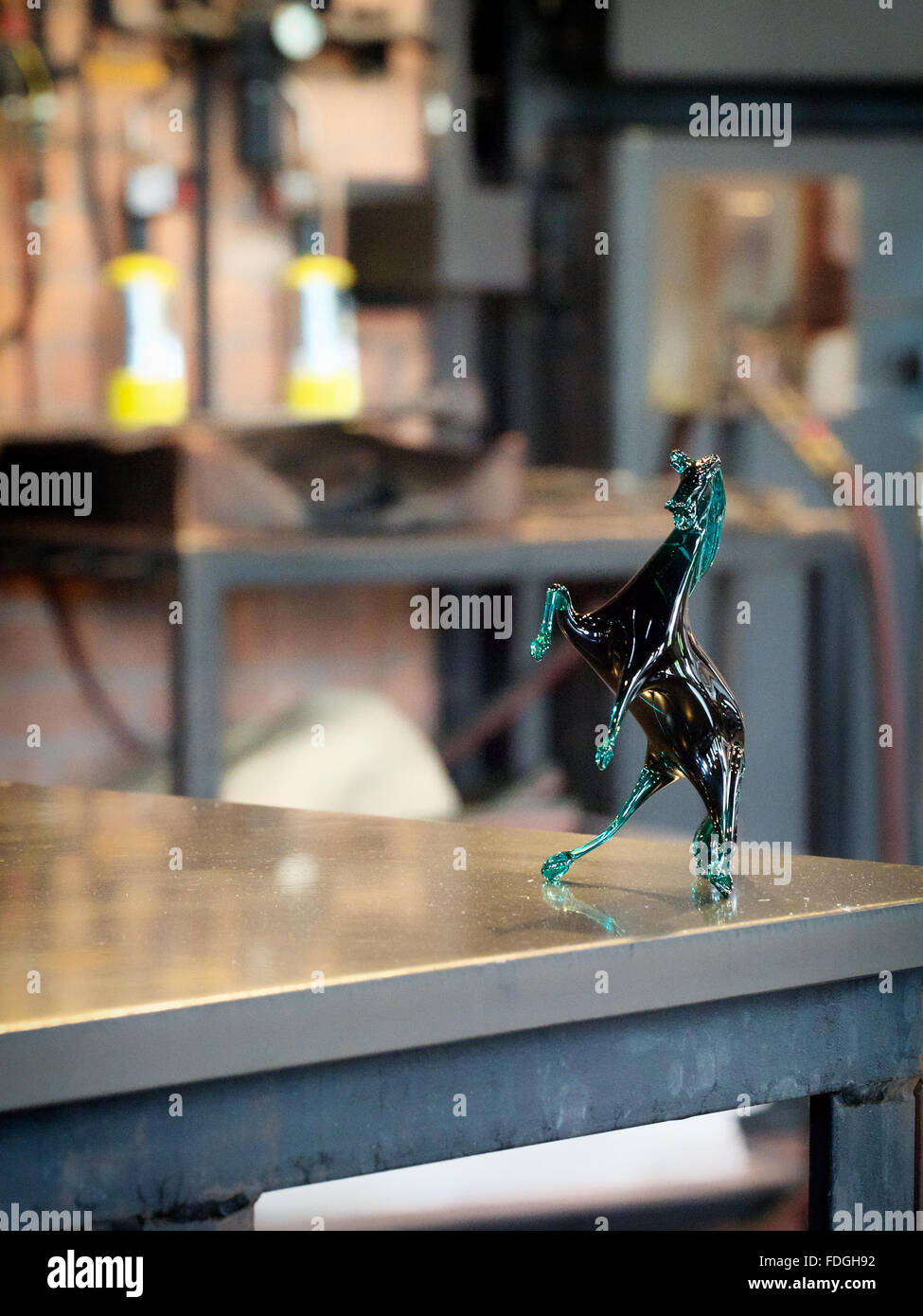 Hand-blown glass art piece of a horse rearing back on it's hind legs Stock Photo