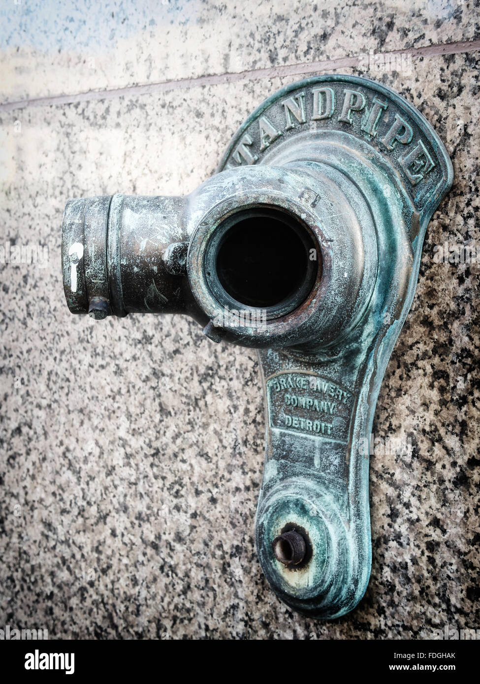 Close up view of a standpipe water connection for the fire department on an urban building in Detroit Stock Photo