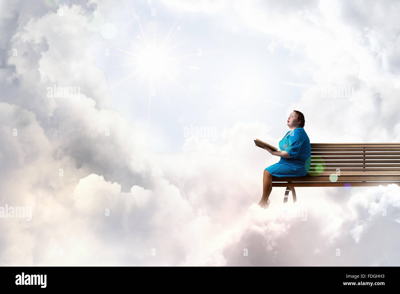 Plus Size Surprised Woman With Book In Hands Sitting On Bench