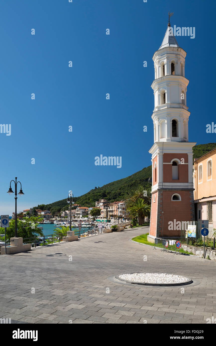 White church steeple against a blue sky at the harbor of Scario at the coast of the Mediterranean Sea in Cilento,Campania,Italy Stock Photo