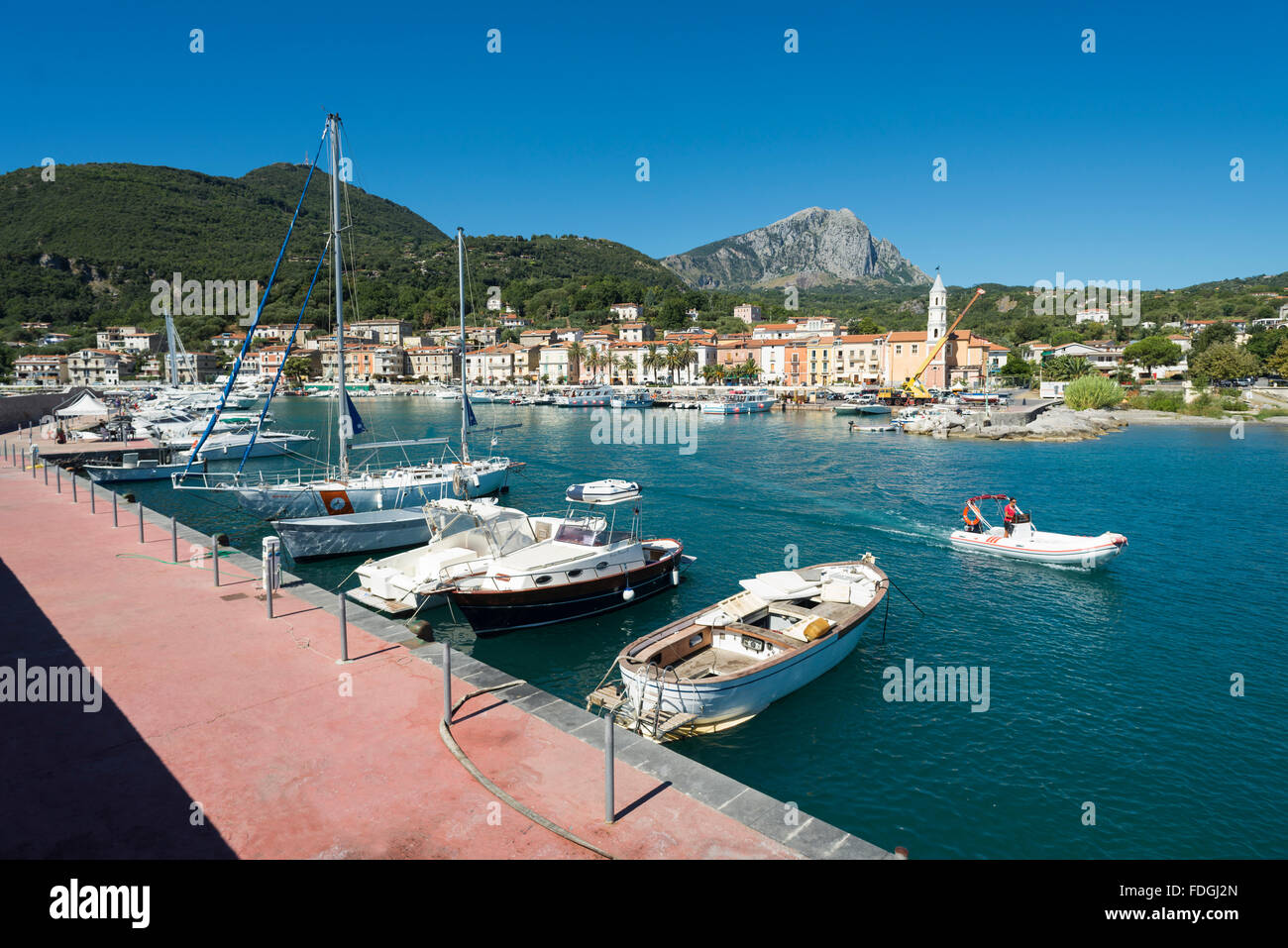 Fishing boats, motor boats and yachts in the picturesque harbor of Scario on the coast of the Mediterranean Sea in Cilento,Italy Stock Photo