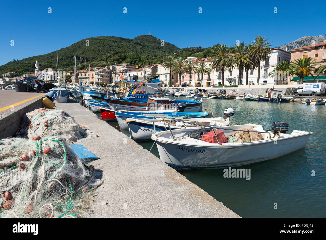 Fishing and motor boats in the picturesque harbor of Scario on the coast of the Mediterranean Sea in Cilento, Campania, Italy Stock Photo