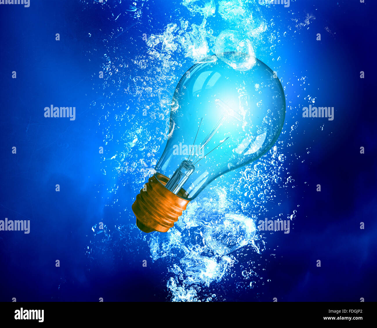 Energy concept with light bulb under clear blue water Stock Photo - Alamy