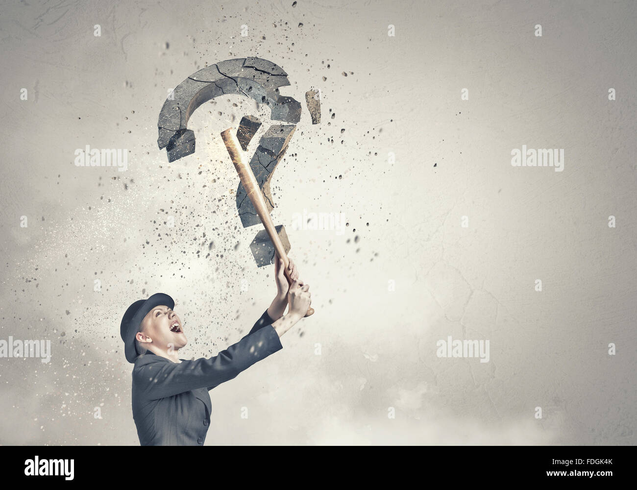 Young emotional woman crashing question sign with baseball bat Stock