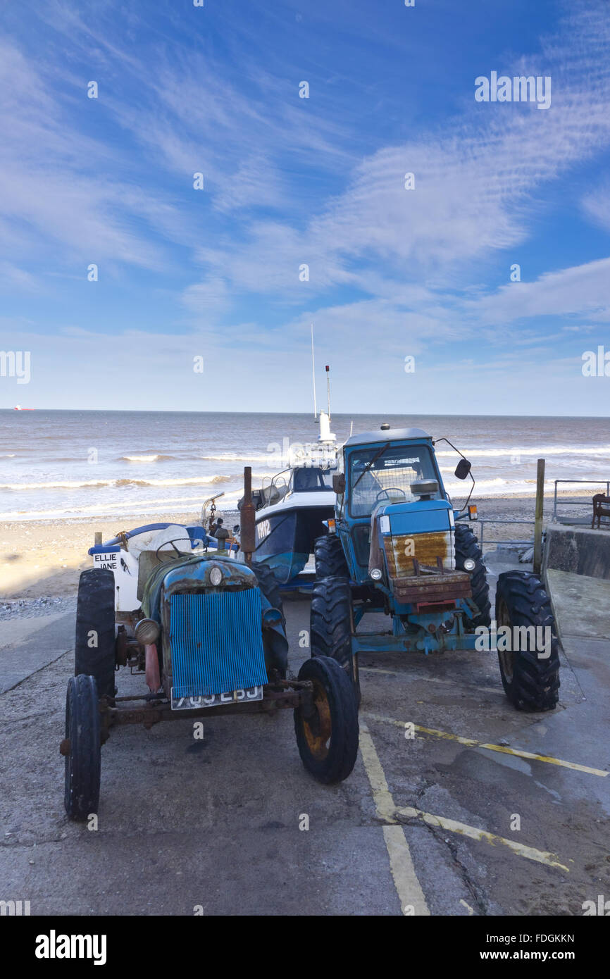 fishing boats tractors East Runton gap Stock Photo Alamy