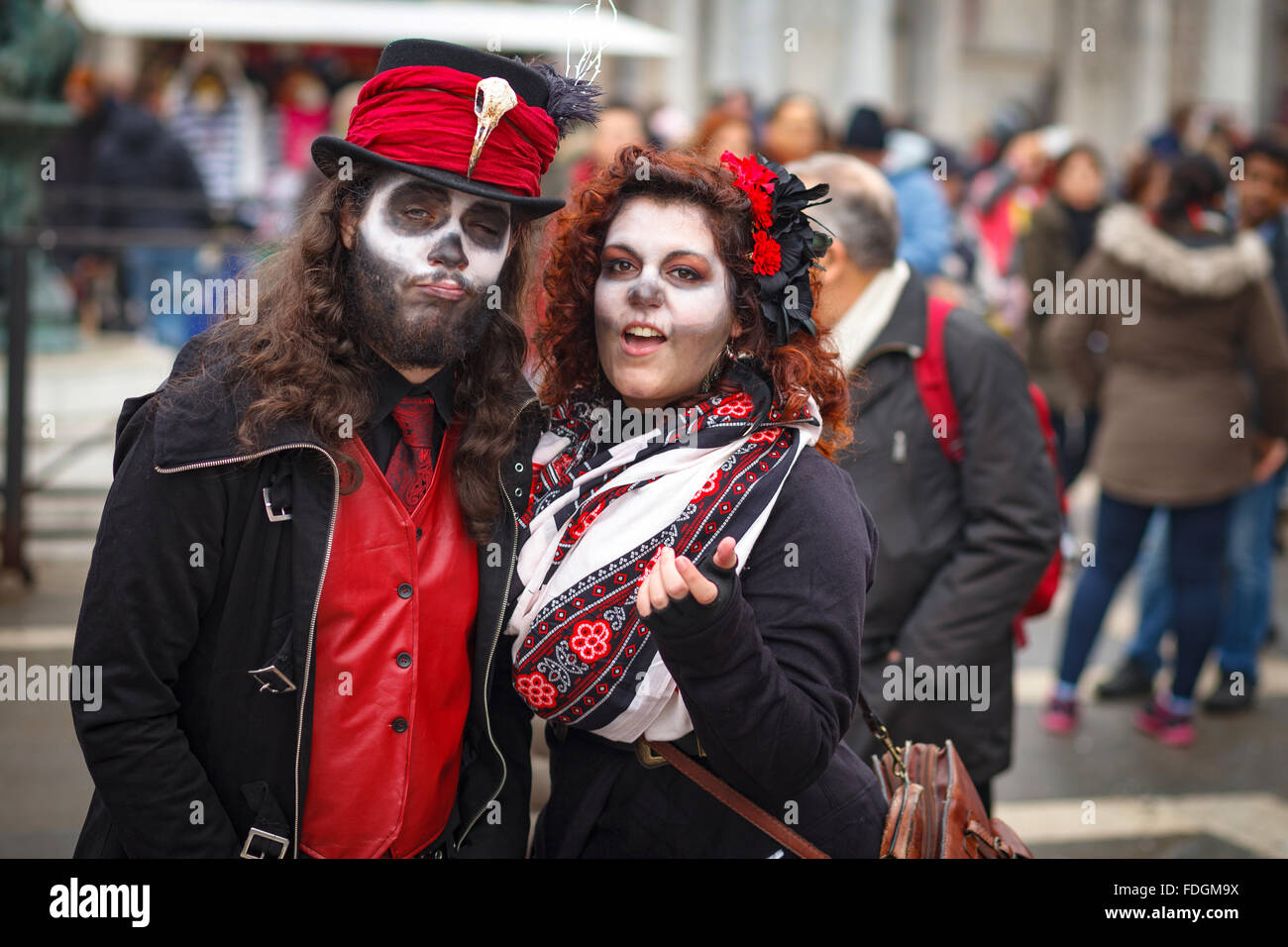 A couple dressed and face painted for carnival clothes in Venice Italy Stock Photo