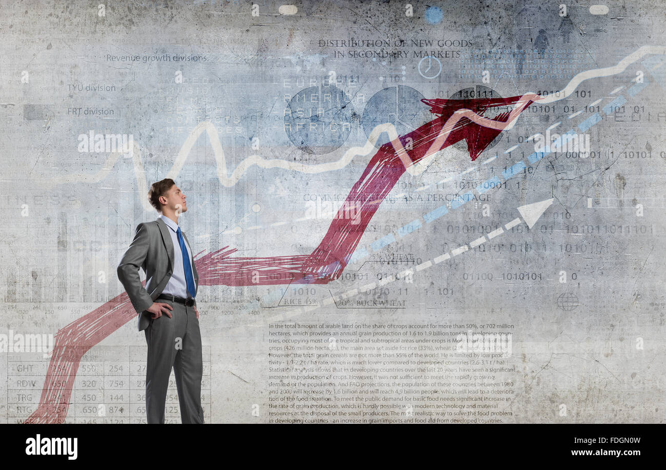 Confident businessman with arms on waist red growing arrow graph hi-res ...