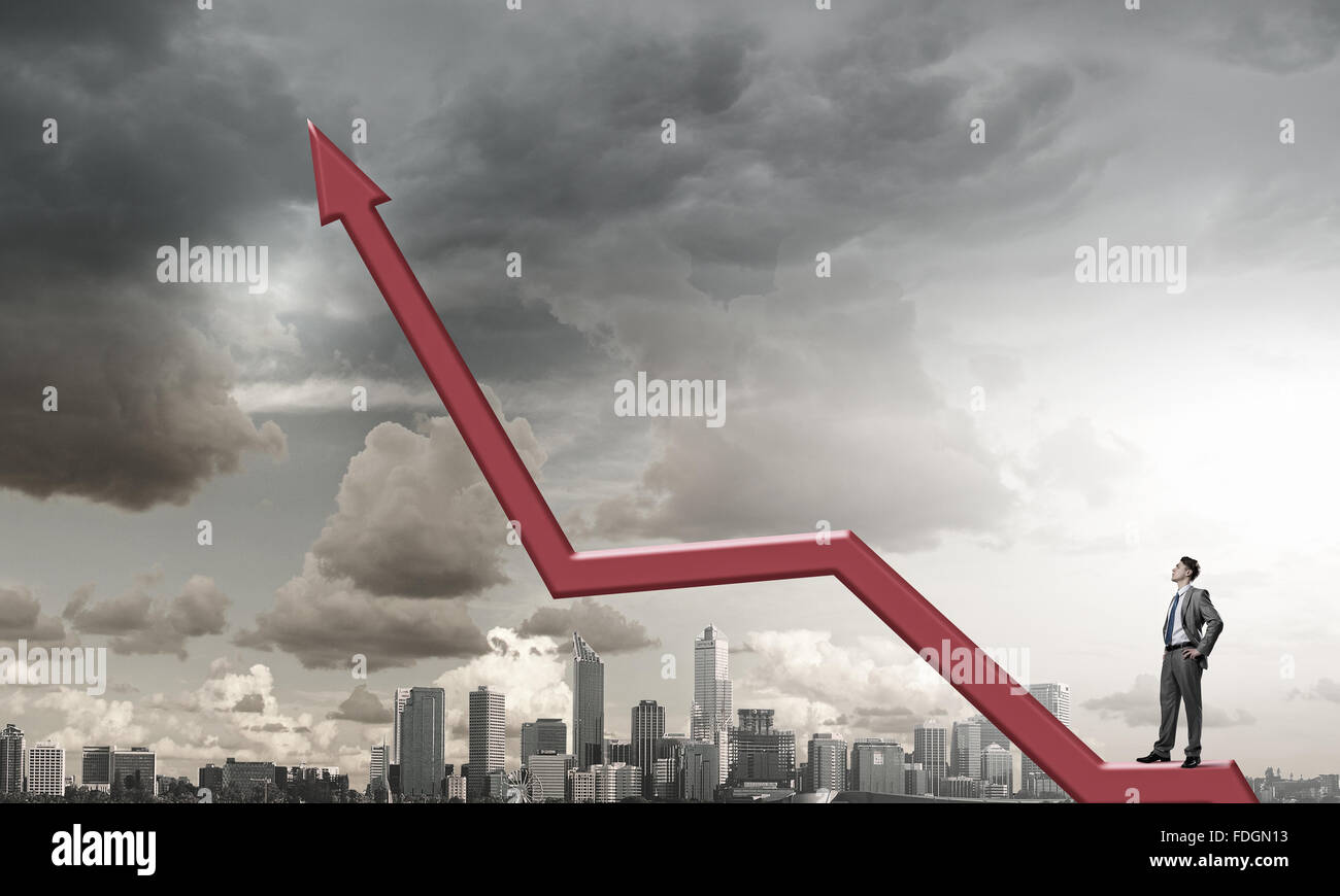Businessman standing on arrow hi-res stock photography and images - Alamy