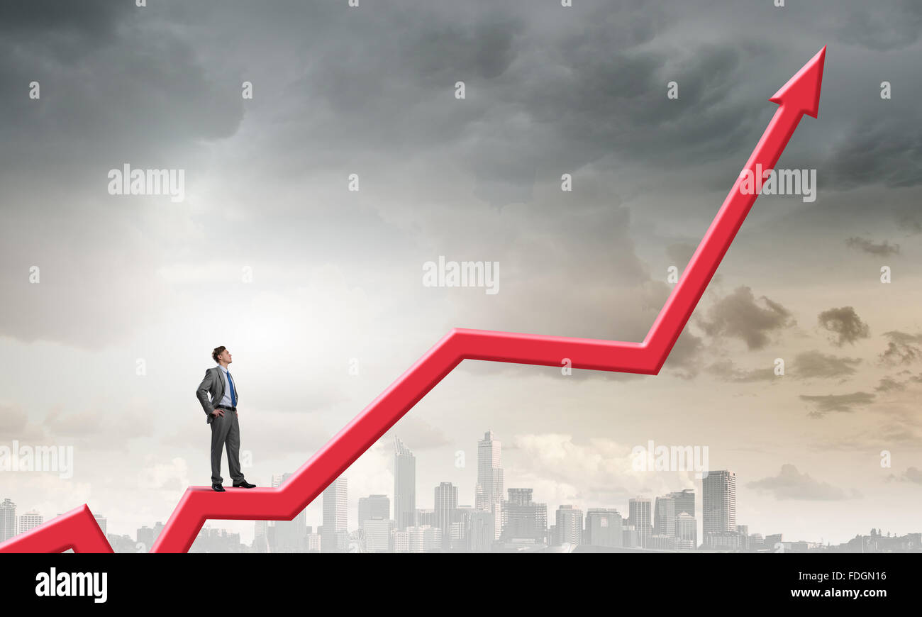 Businessman standing on arrow hi-res stock photography and images - Alamy