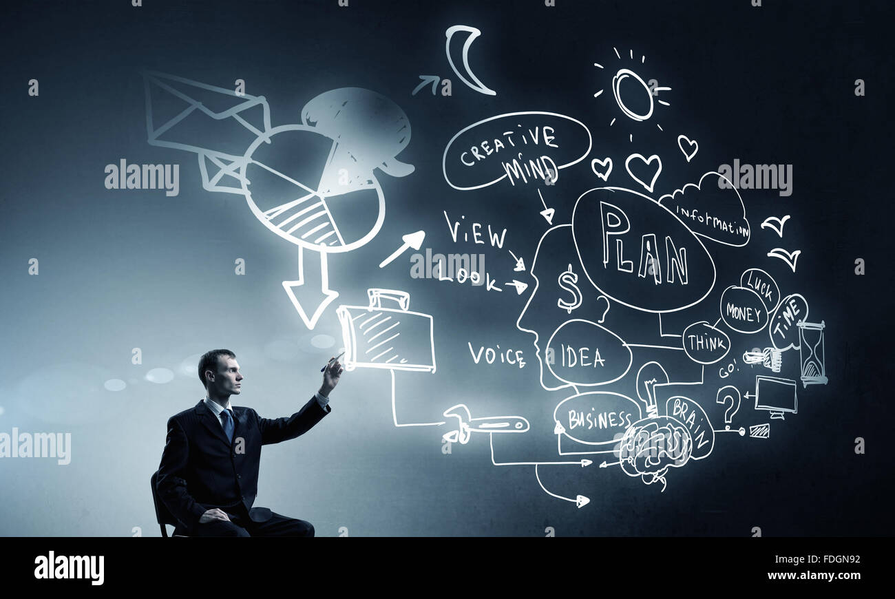 Businessman writing with marker strategy sketches on screen Stock Photo ...