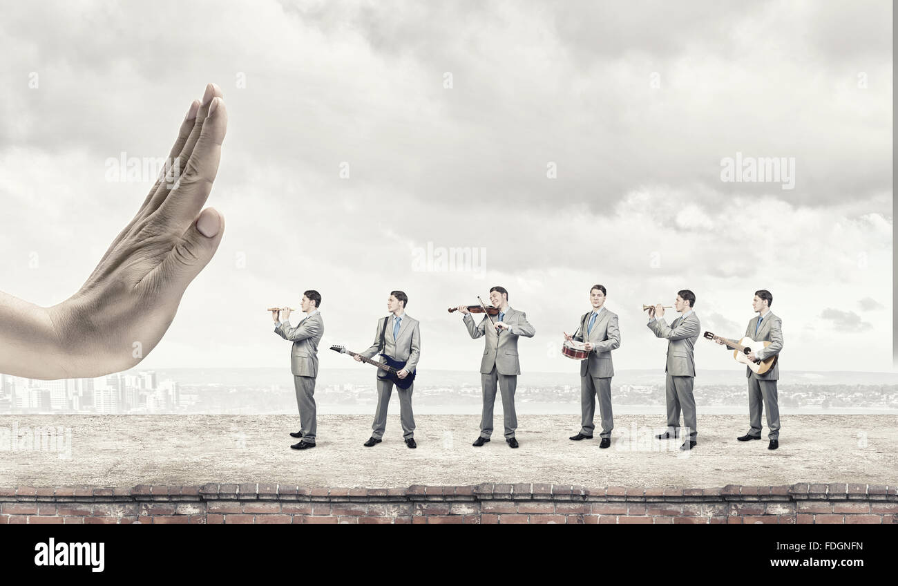 Man orchestra in suit playing different music instruments Stock Photo ...