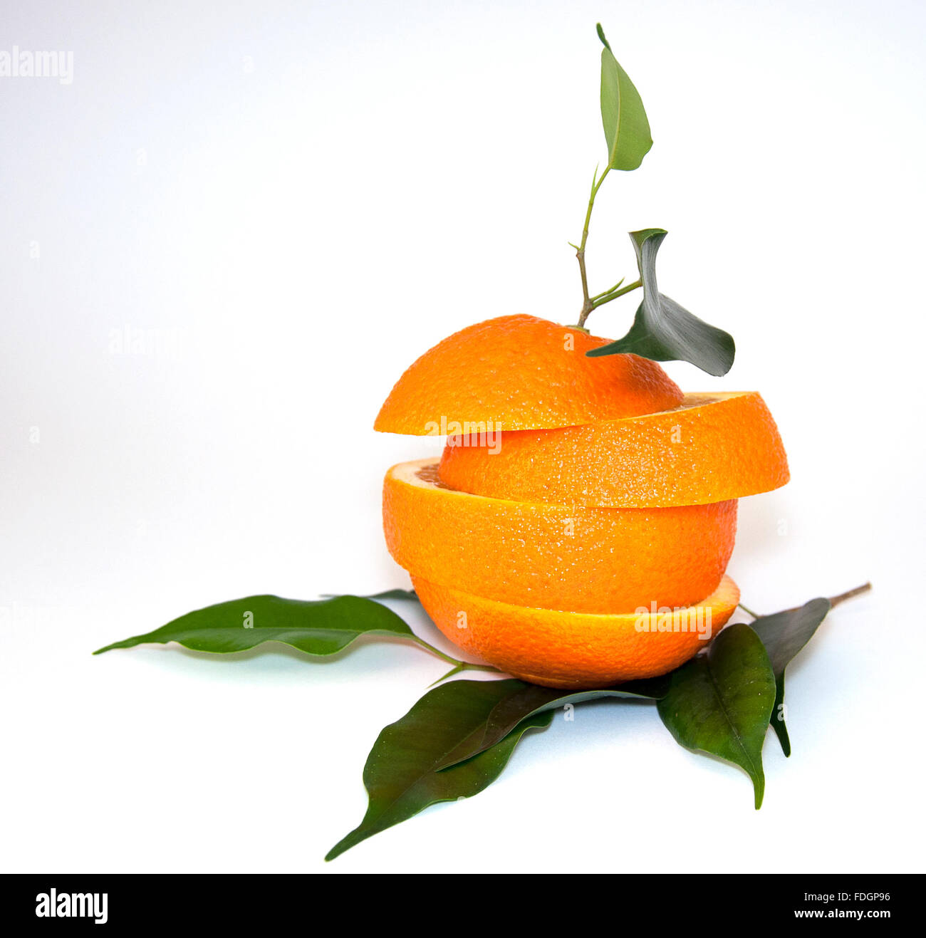 fresh orange with green leaves on a white background Stock Photo