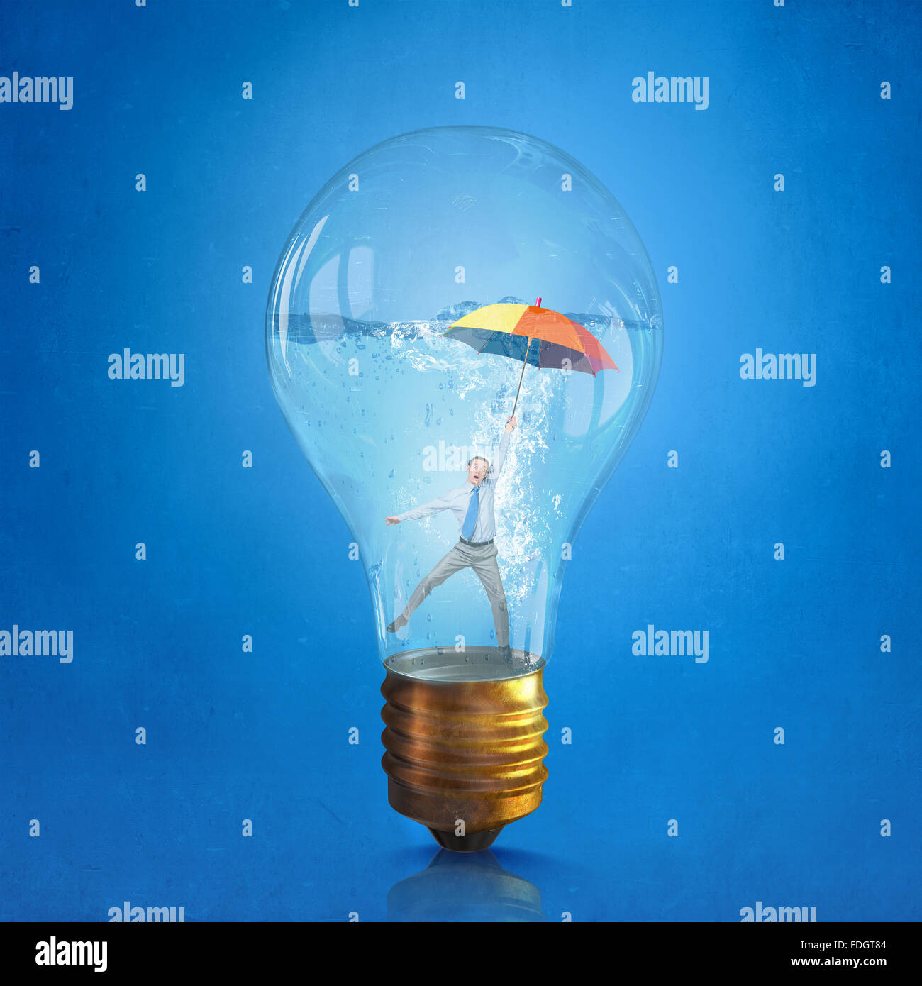 Glass light bulb filled with clear water and businessman inside Stock