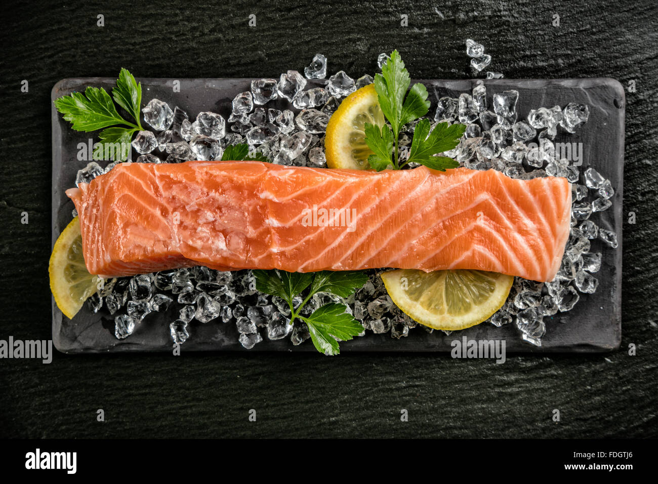 Salmon filet served on black stone Stock Photo