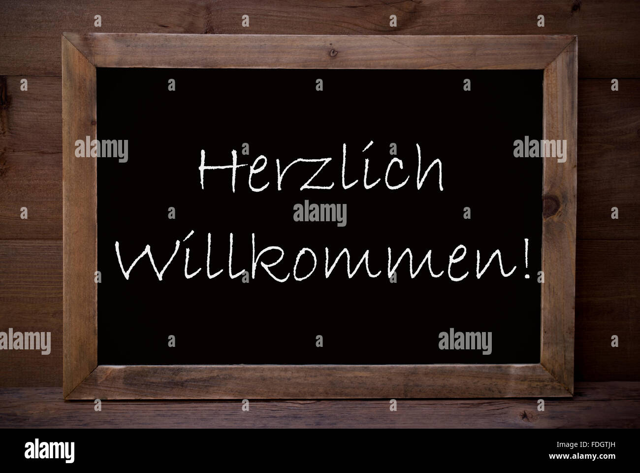 Chalkboard With Herzlich Willkommen Means Welcome Stock Photo