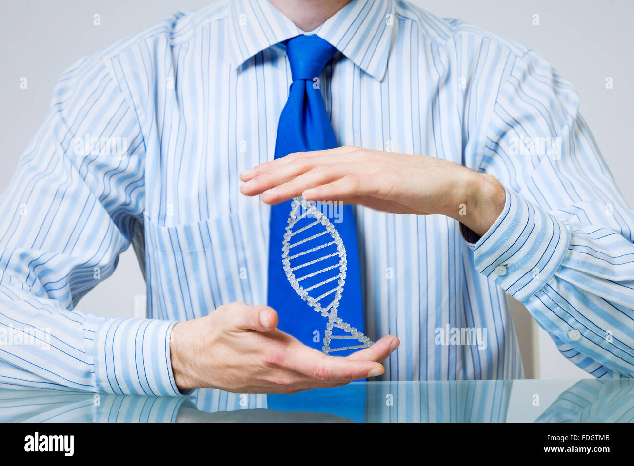 Hands of businessman holding with care molecule concept Stock Photo - Alamy