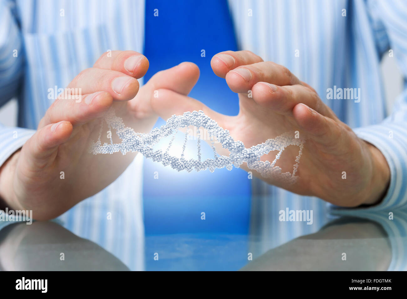 Hands of businessman holding with care molecule concept Stock Photo - Alamy