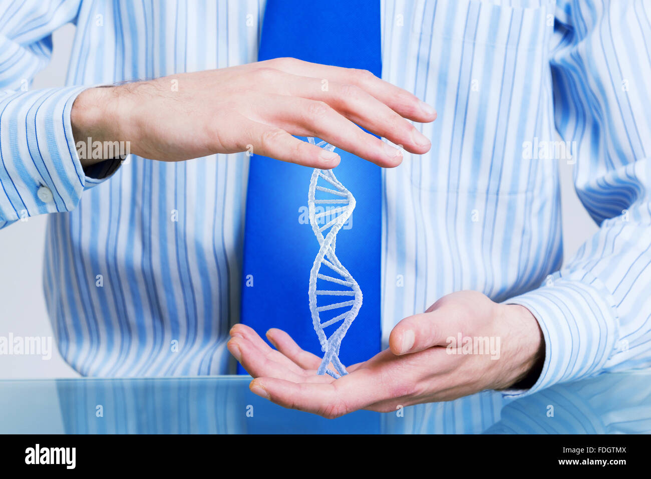 Hands of businessman holding with care molecule concept Stock Photo - Alamy