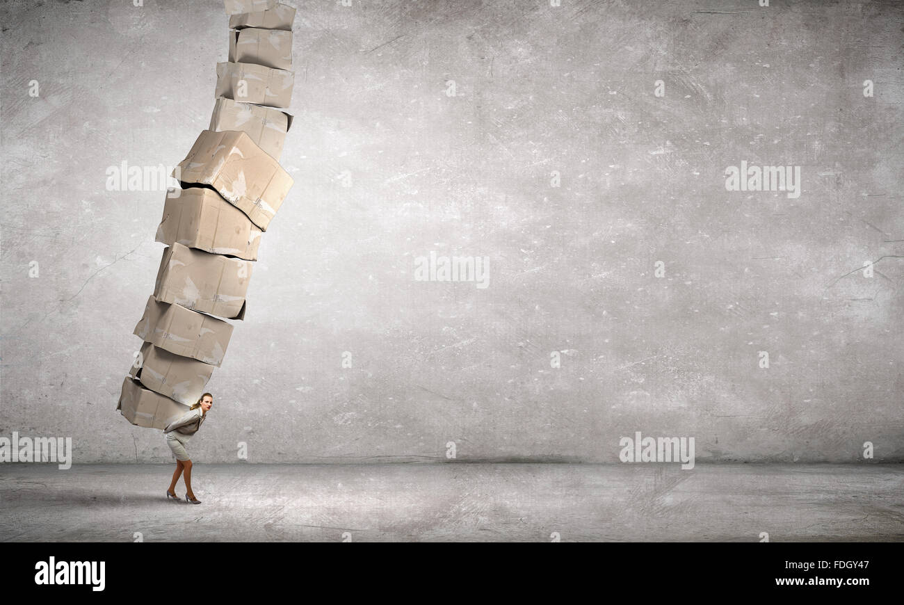 Woman carrying heavy box on her back hi-res stock photography and ...