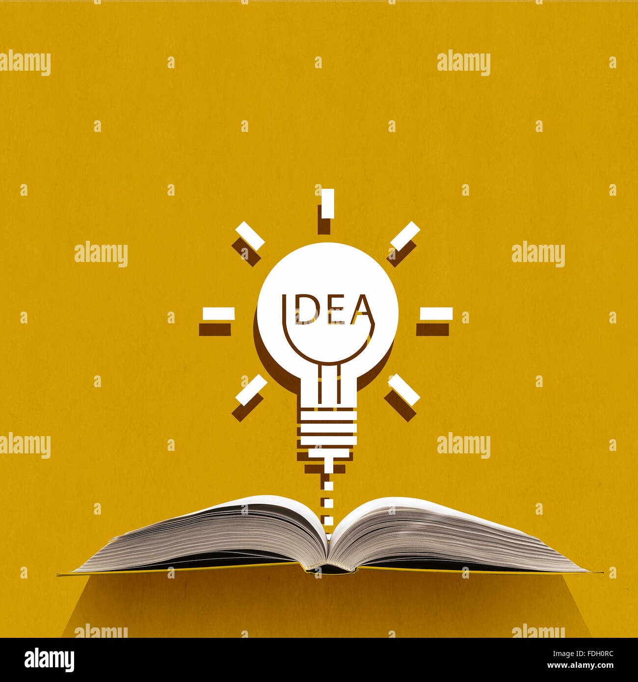 Opened book and idea light bulb on pages Stock Photo - Alamy