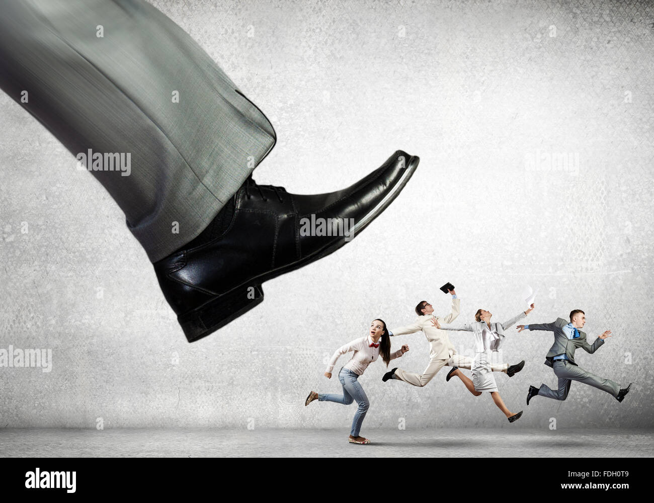 Foot Riding Away Big businessman foot kicking businesspeople running away Stock Photo ...