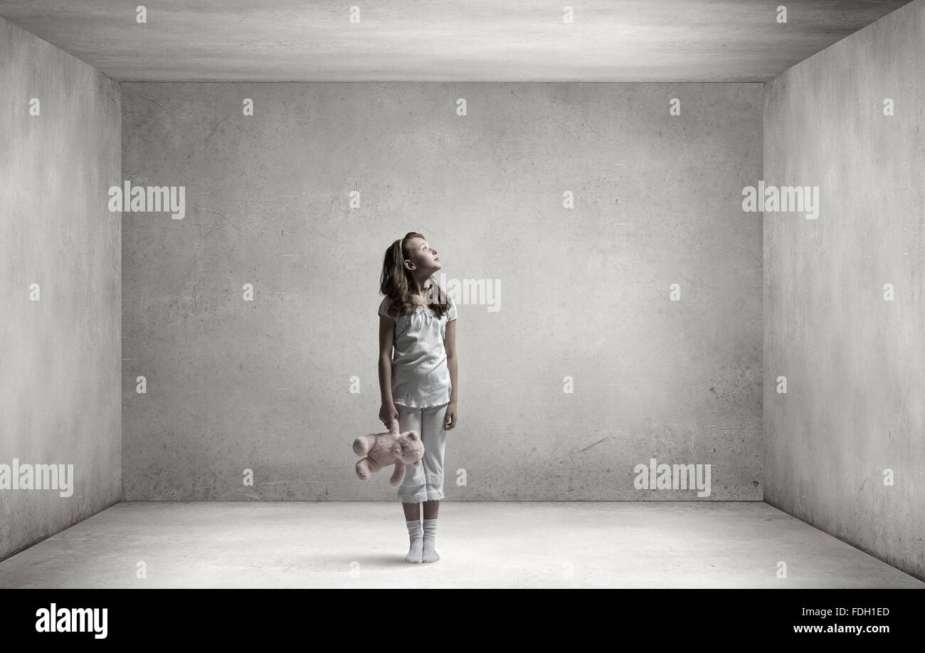 Cute girl wearing pajamas with toy bear in hand Stock Photo - Alamy