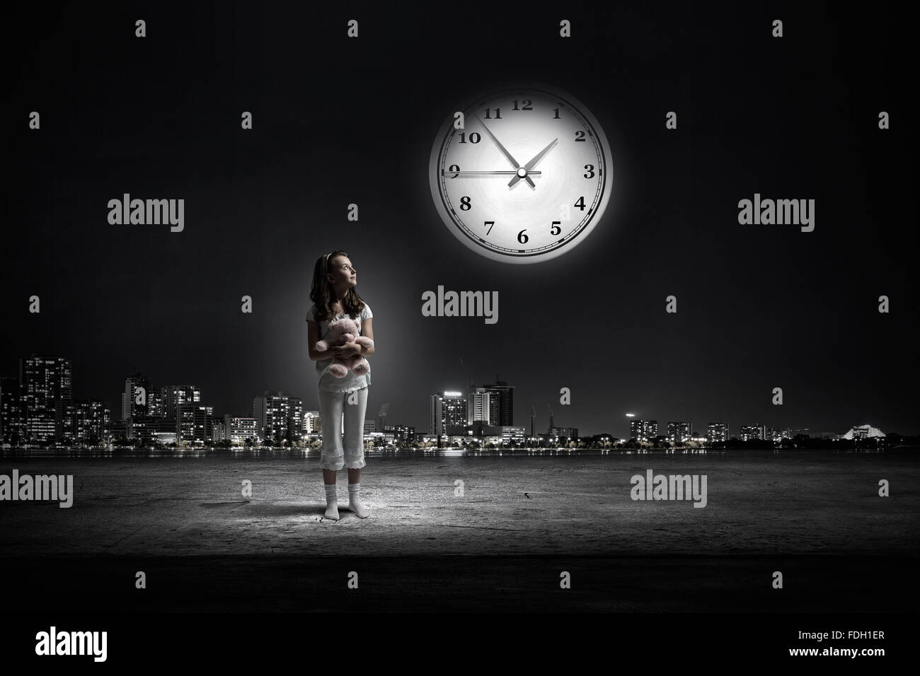 Cute girl wearing pajamas with toy bear in hand Stock Photo - Alamy