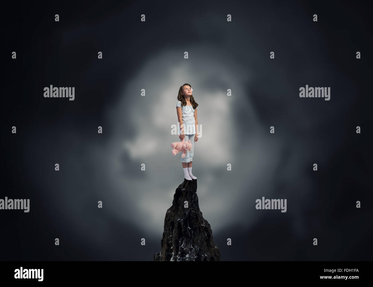 Cute girl wearing pajamas with toy bear in hand Stock Photo - Alamy