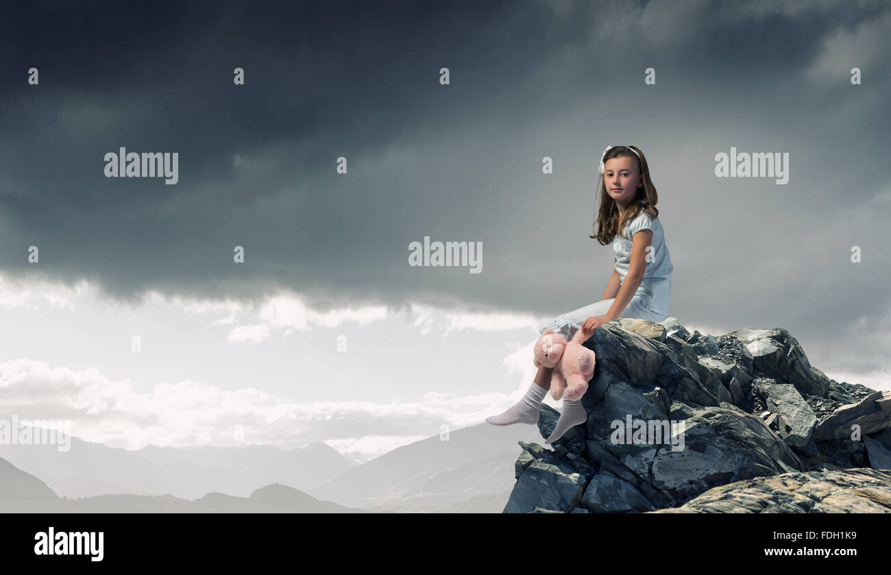 Cute girl wearing pajamas with toy bear in hand Stock Photo - Alamy