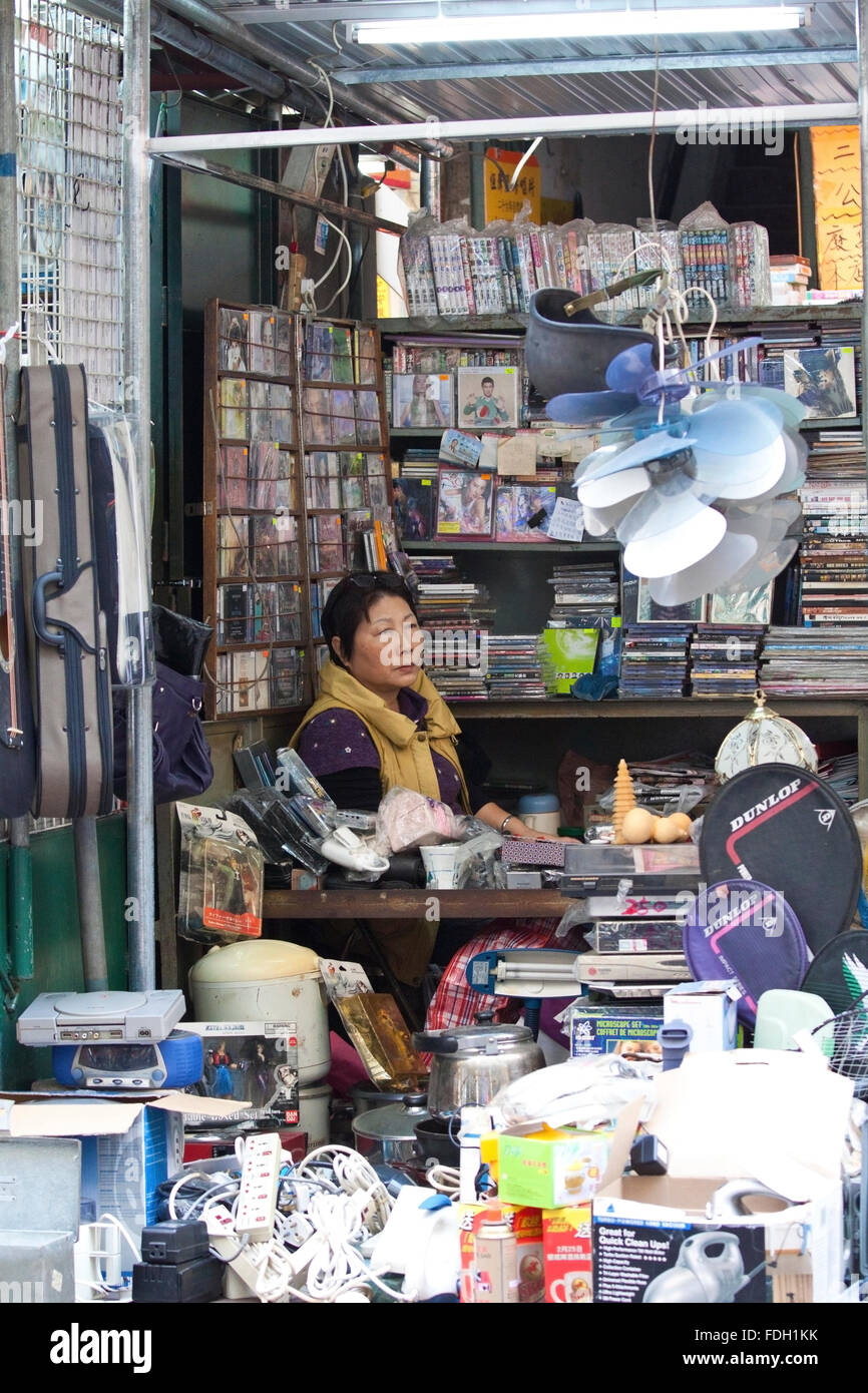 Chinese hawker selling electric appliances in Ap Liu Street, Hong Kong
