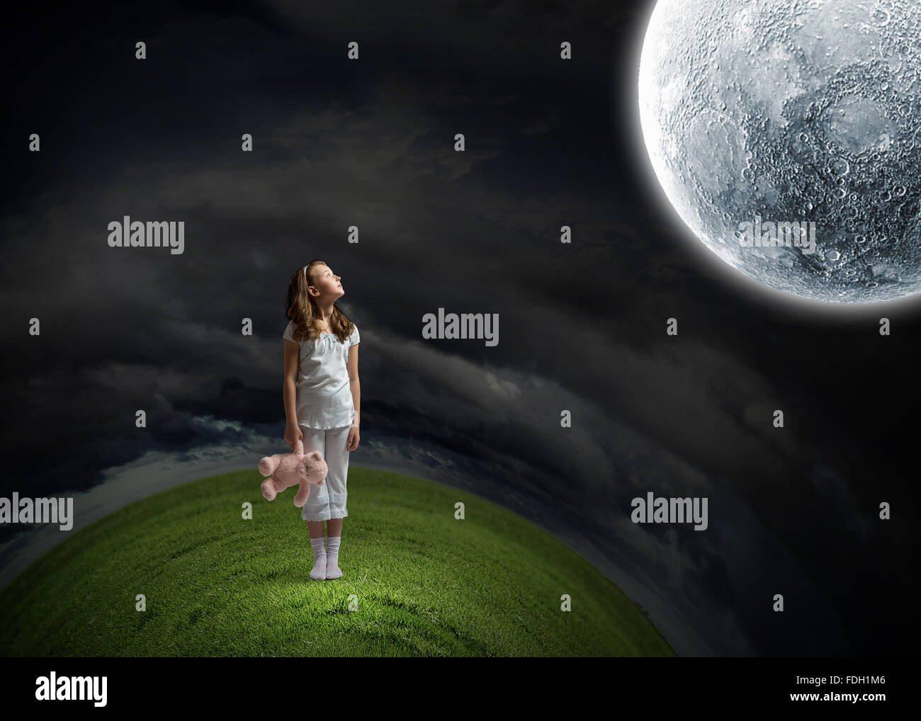 Cute girl wearing pajamas with toy bear in hand Stock Photo - Alamy