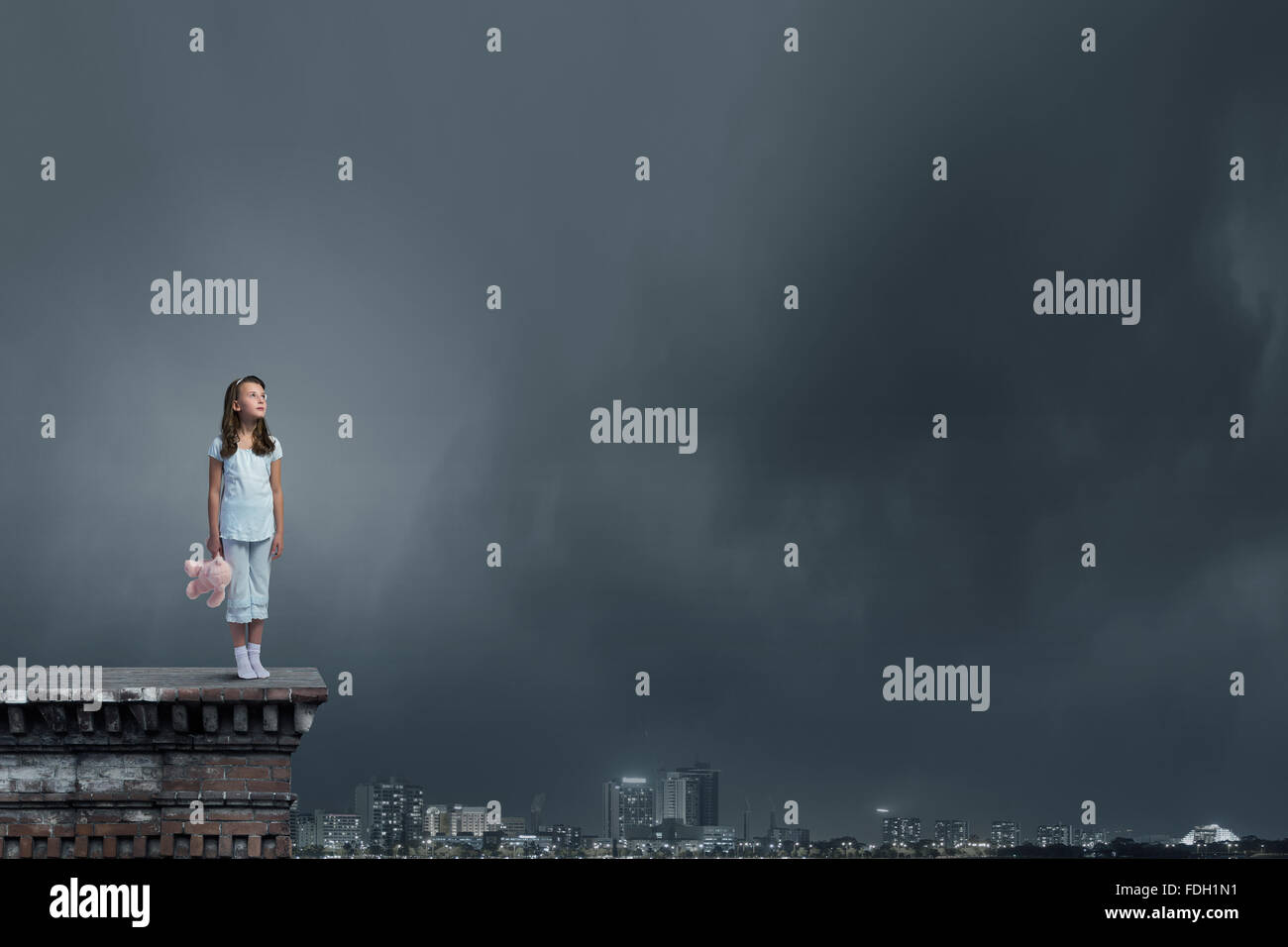 Cute girl wearing pajamas with toy bear in hand Stock Photo - Alamy