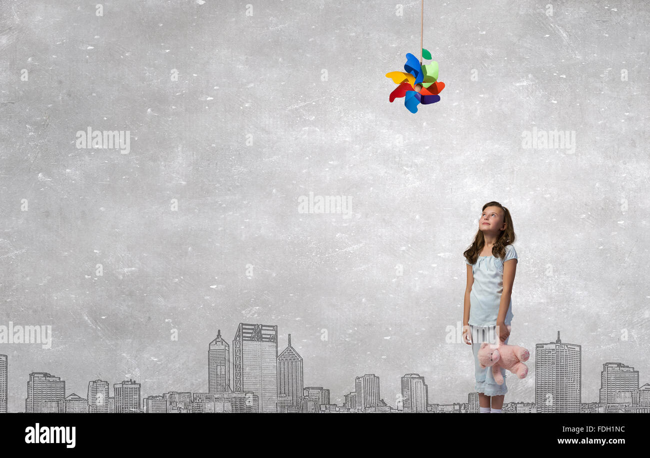 Cute girl wearing pajamas with toy bear in hand Stock Photo - Alamy