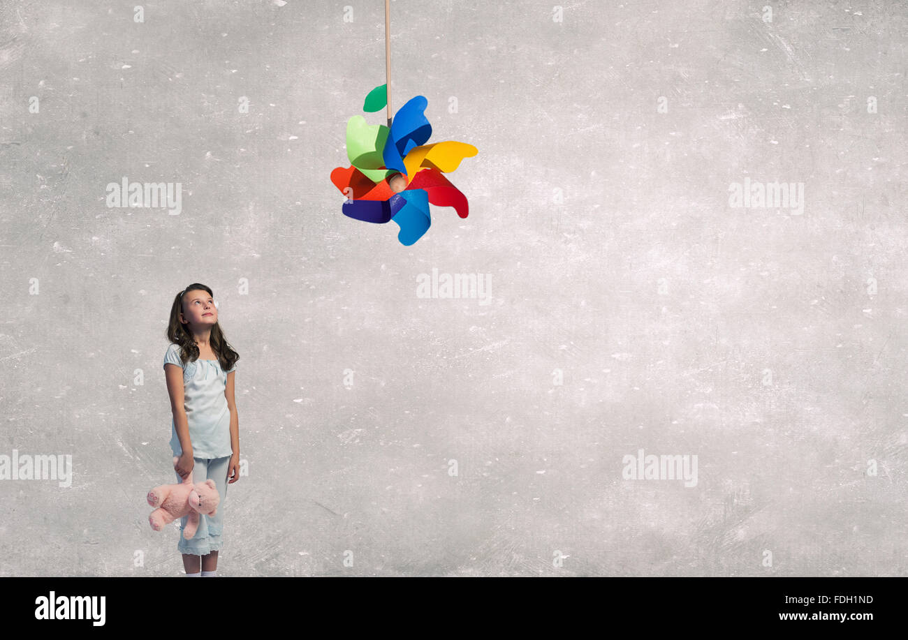 Cute girl wearing pajamas with toy bear in hand Stock Photo - Alamy