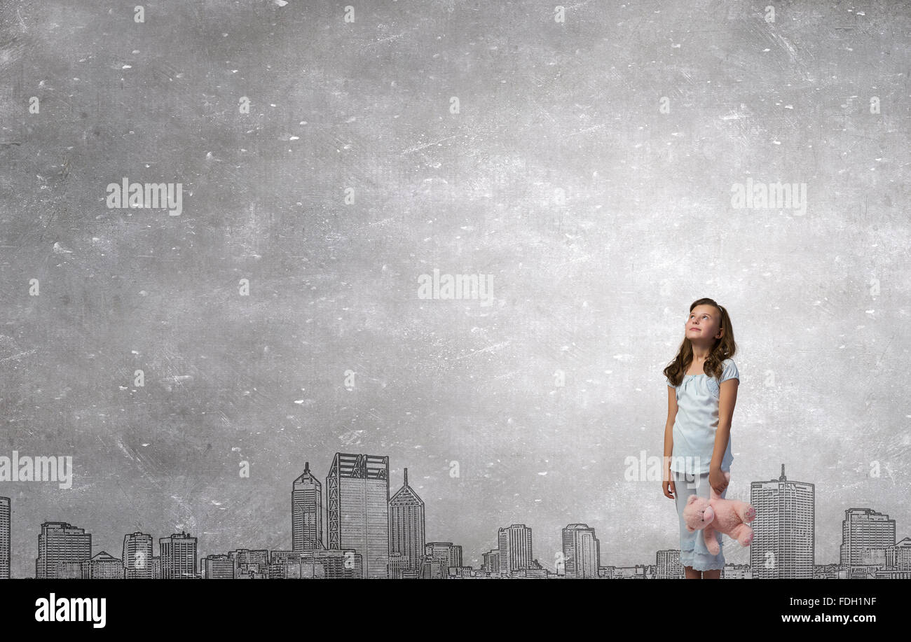 Cute girl wearing pajamas with toy bear in hand Stock Photo - Alamy