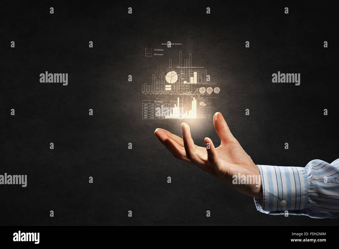 Businessman holding digital image of infographs in hand Stock Photo - Alamy