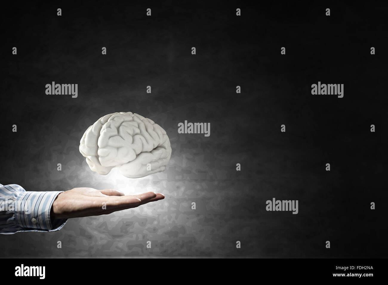 Businessman holding image of human brain in palm Stock Photo - Alamy