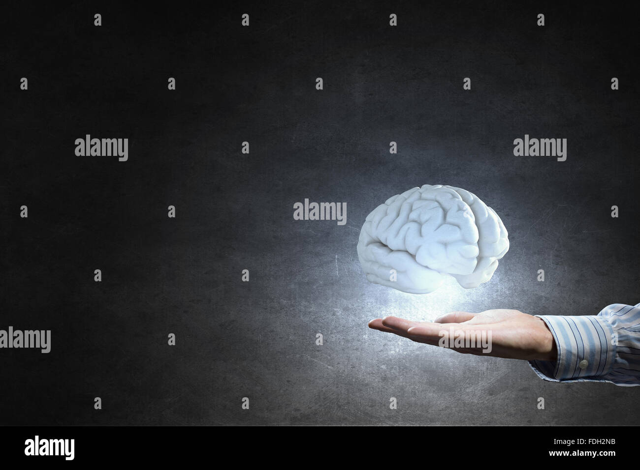 Businessman holding image of human brain in palm Stock Photo - Alamy