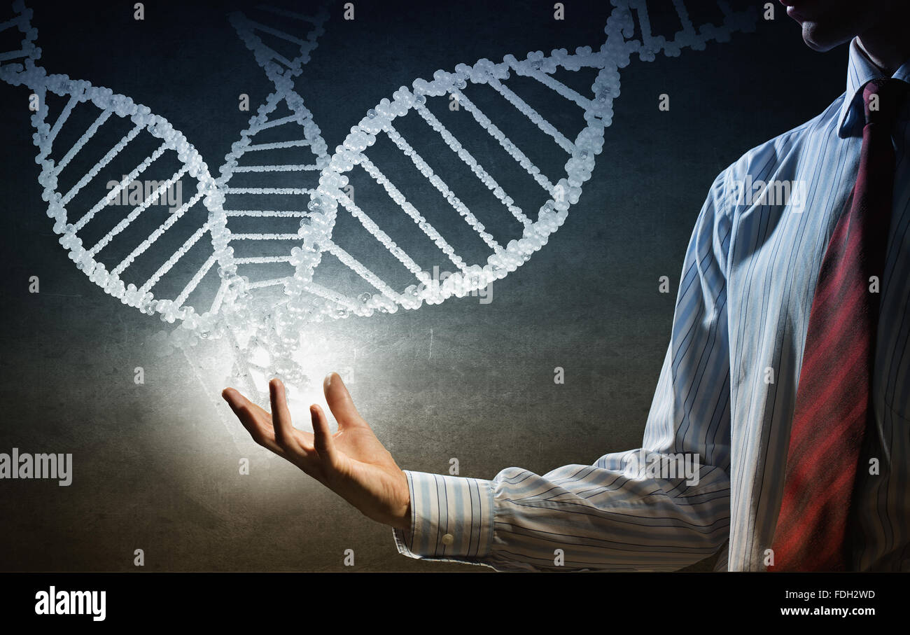 Hand of businessman holding dna molecule concept Stock Photo - Alamy