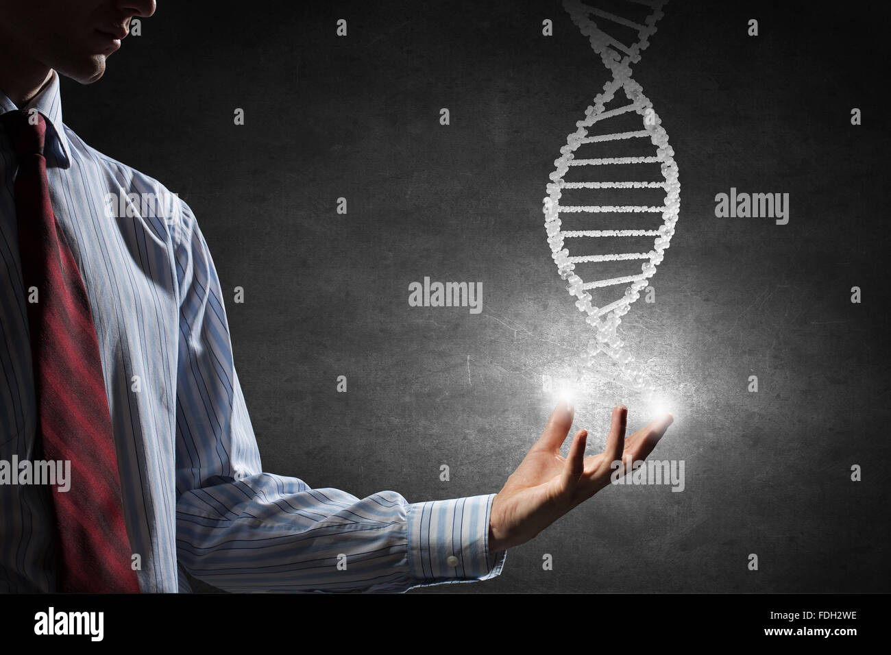 Hand of businessman holding dna molecule concept Stock Photo - Alamy