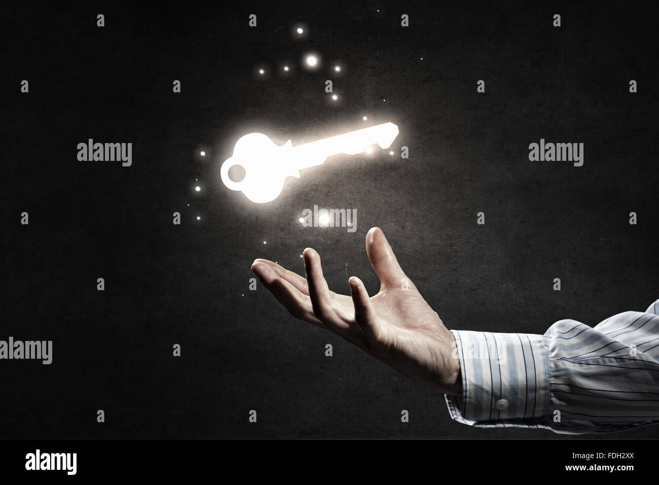 Close up of businessman hand showing key to success Stock Photo - Alamy