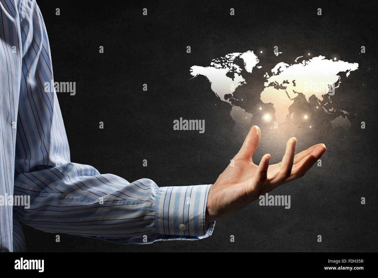 Close up of businessman holding world map in hands Stock Photo - Alamy