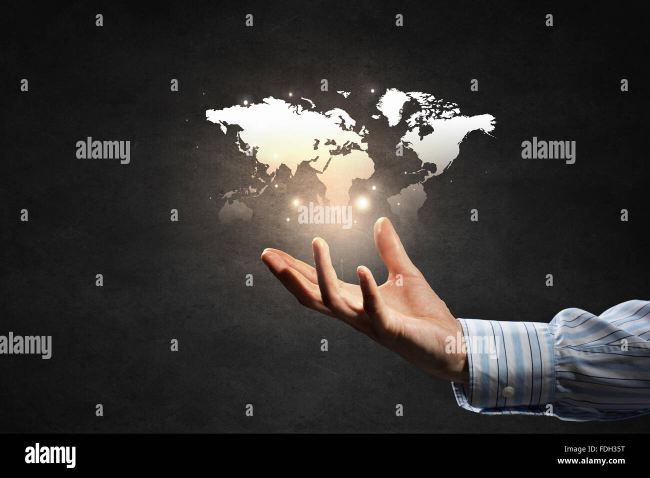 Close up of businessman holding world map in hands Stock Photo - Alamy