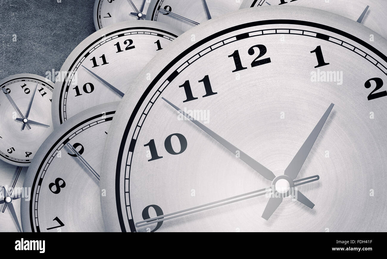 Many round wall clocks on concrete wall Stock Photo - Alamy