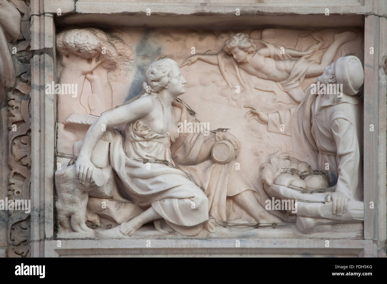 Biblical scene depicted in the marble relief on the main facade of the Milan Cathedral (Duomo di Milano) in Milan, Lombardy, Ita Stock Photo