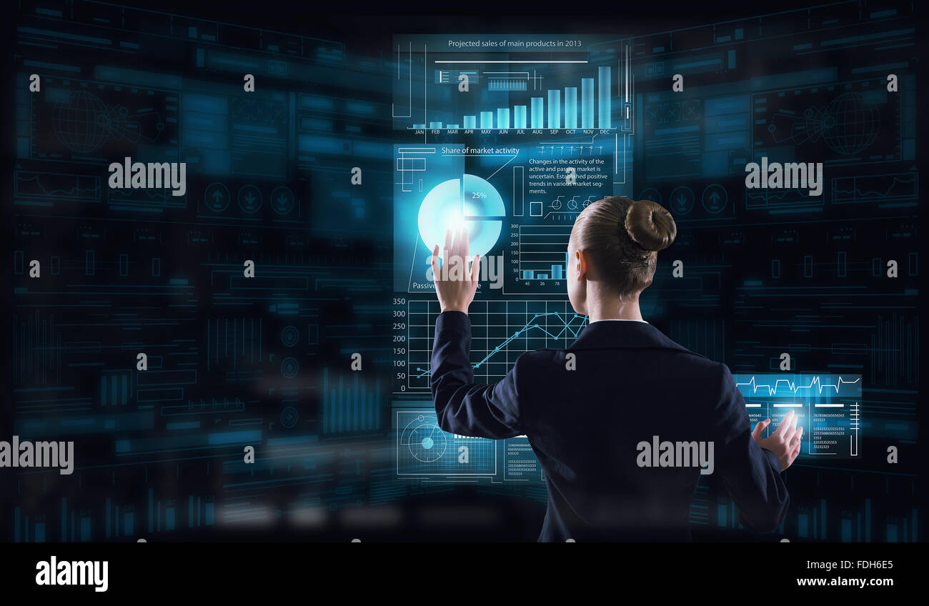 Rear view of businesswoman working with virtual panel interface Stock ...