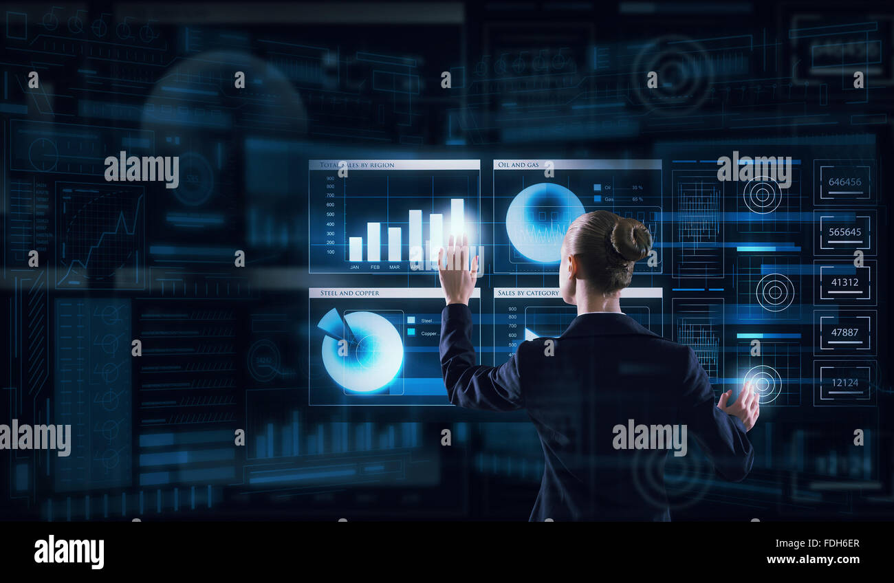 Rear view of businesswoman working with virtual panel interface Stock ...