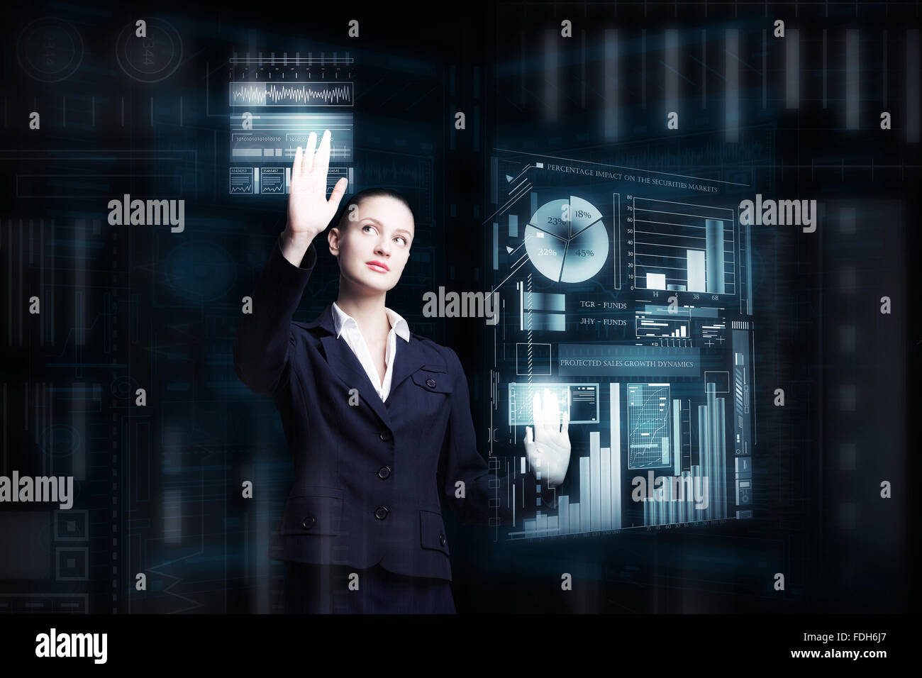 Attractive smiling businesswoman working with virtual panel interface ...